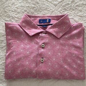 Men’s pink performance golf polo with white floral design by Stitch